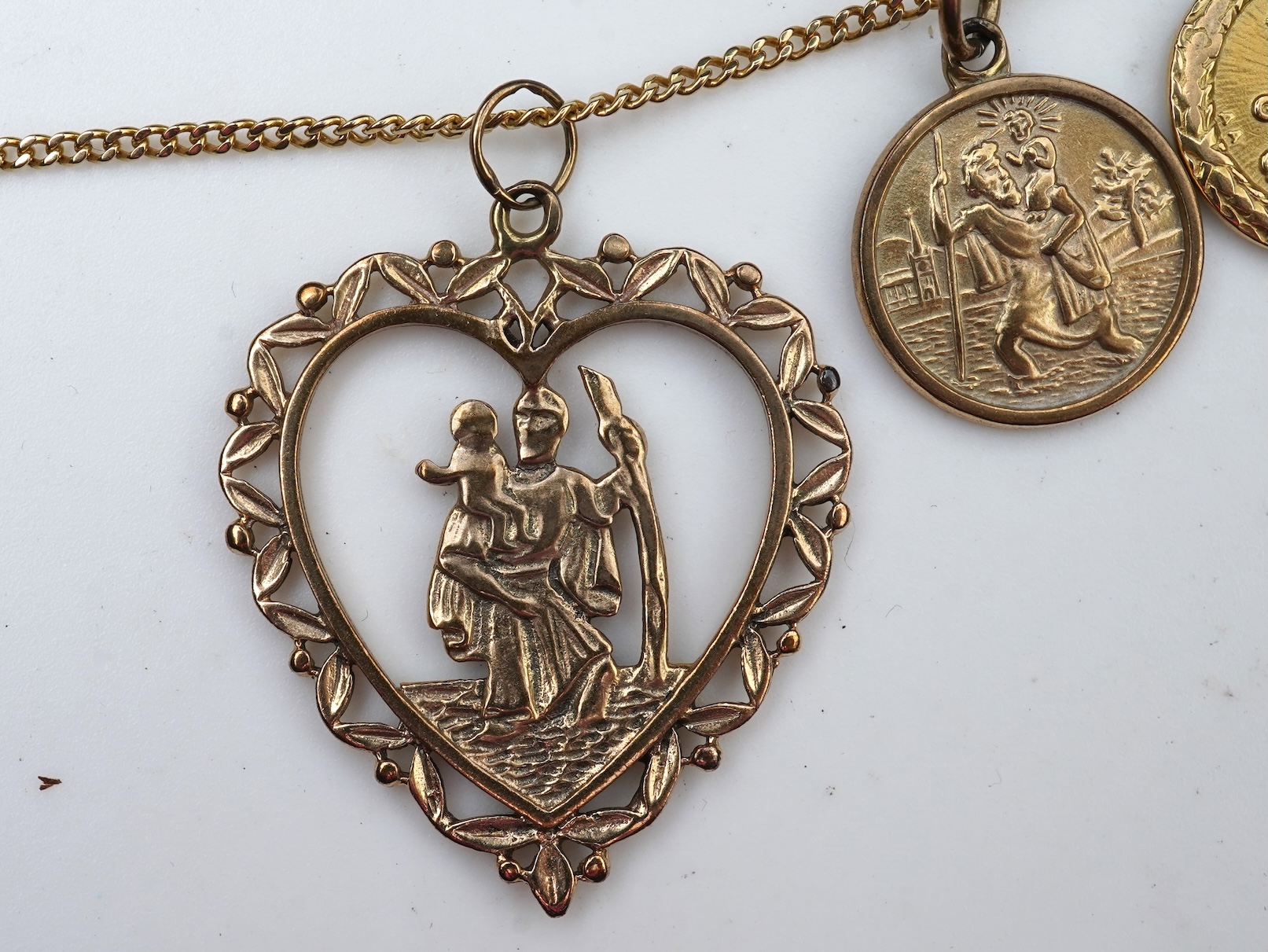 A gold necklace and pair of earrings